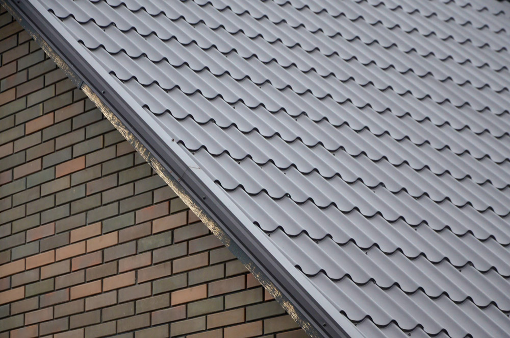 Roofer installing asphalt shingles on a home in Central Florida