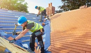Roofer in yellow safety vest on a rooftop in Central Florida